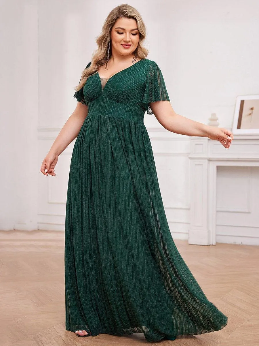 Robe de soirée transparente scintillante col en V taille empire manches courtes